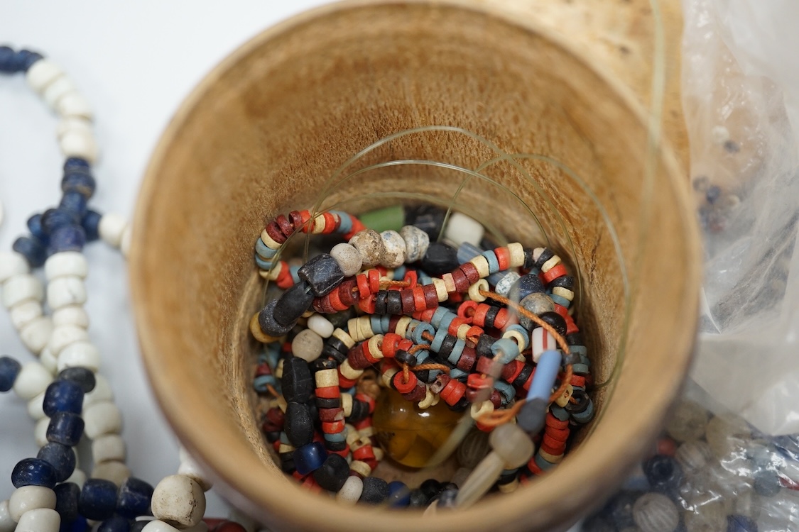 A pair of Turkish bath shoes, a collection of African beads and Middle Eastern vessels etc.